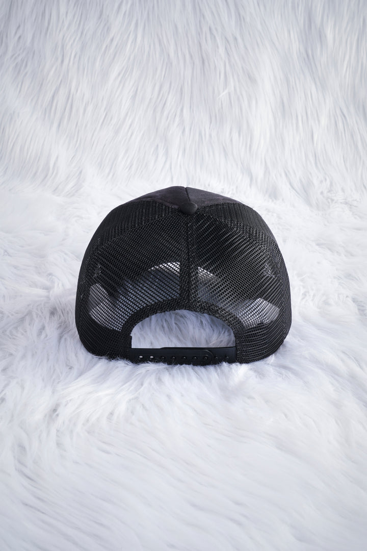 Unpredictable Trucker Hat in Black