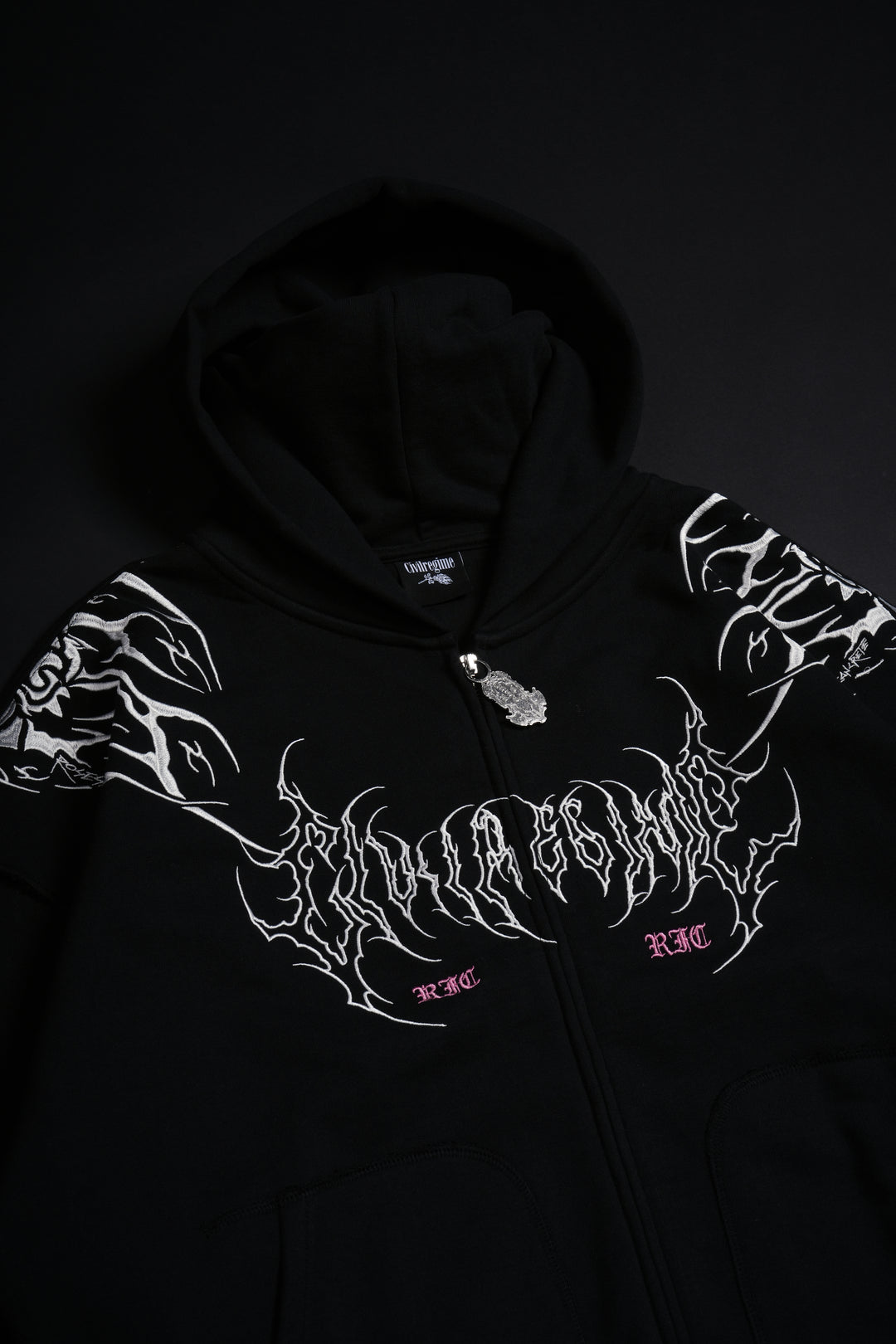 Surging Through The Blossoms Outliers Distressed Zip Up Hoodie in Black/Pink