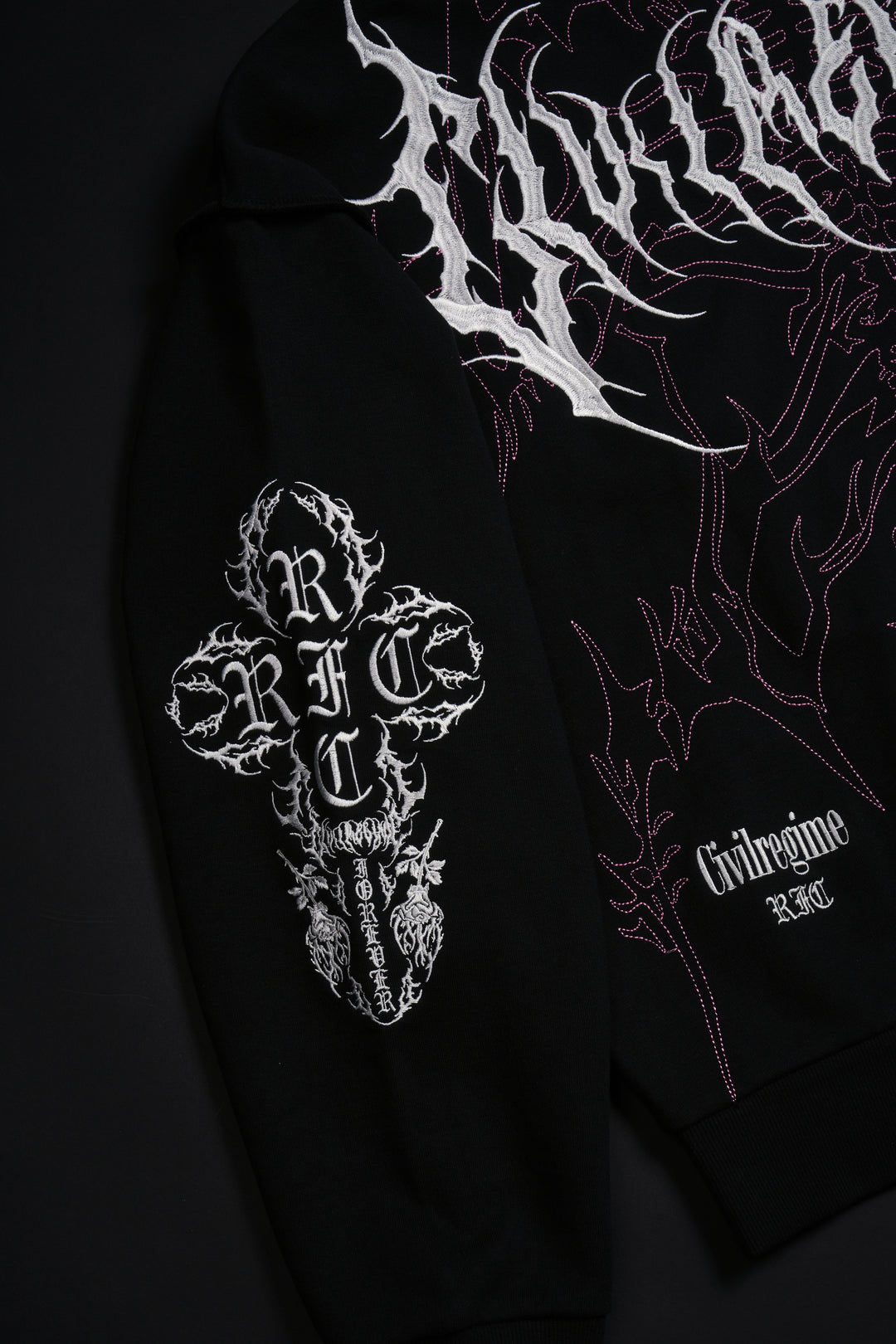 Surging Through The Blossoms Outliers Distressed Zip Up Hoodie in Black/Pink