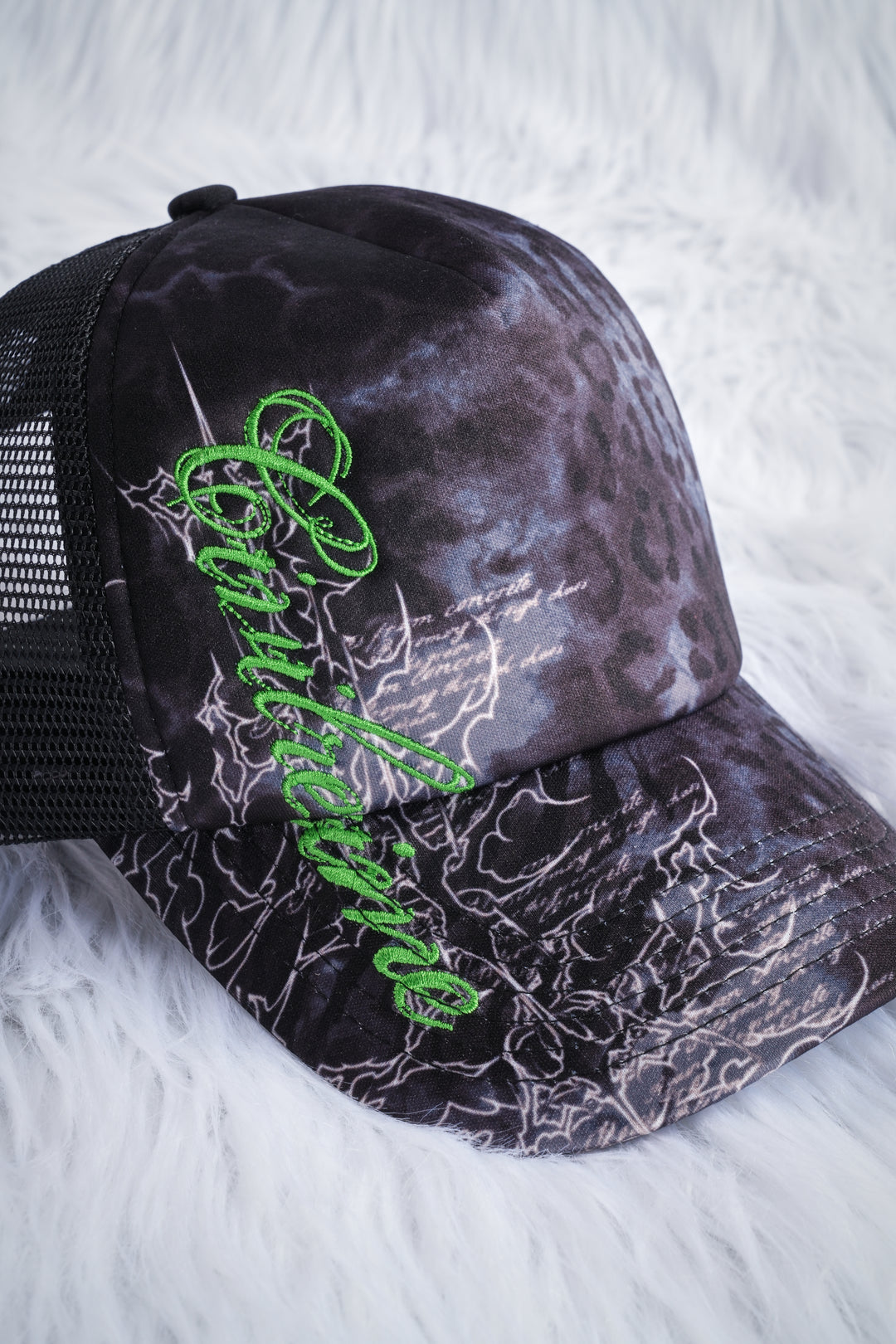 Unpredictable Trucker Hat in Black