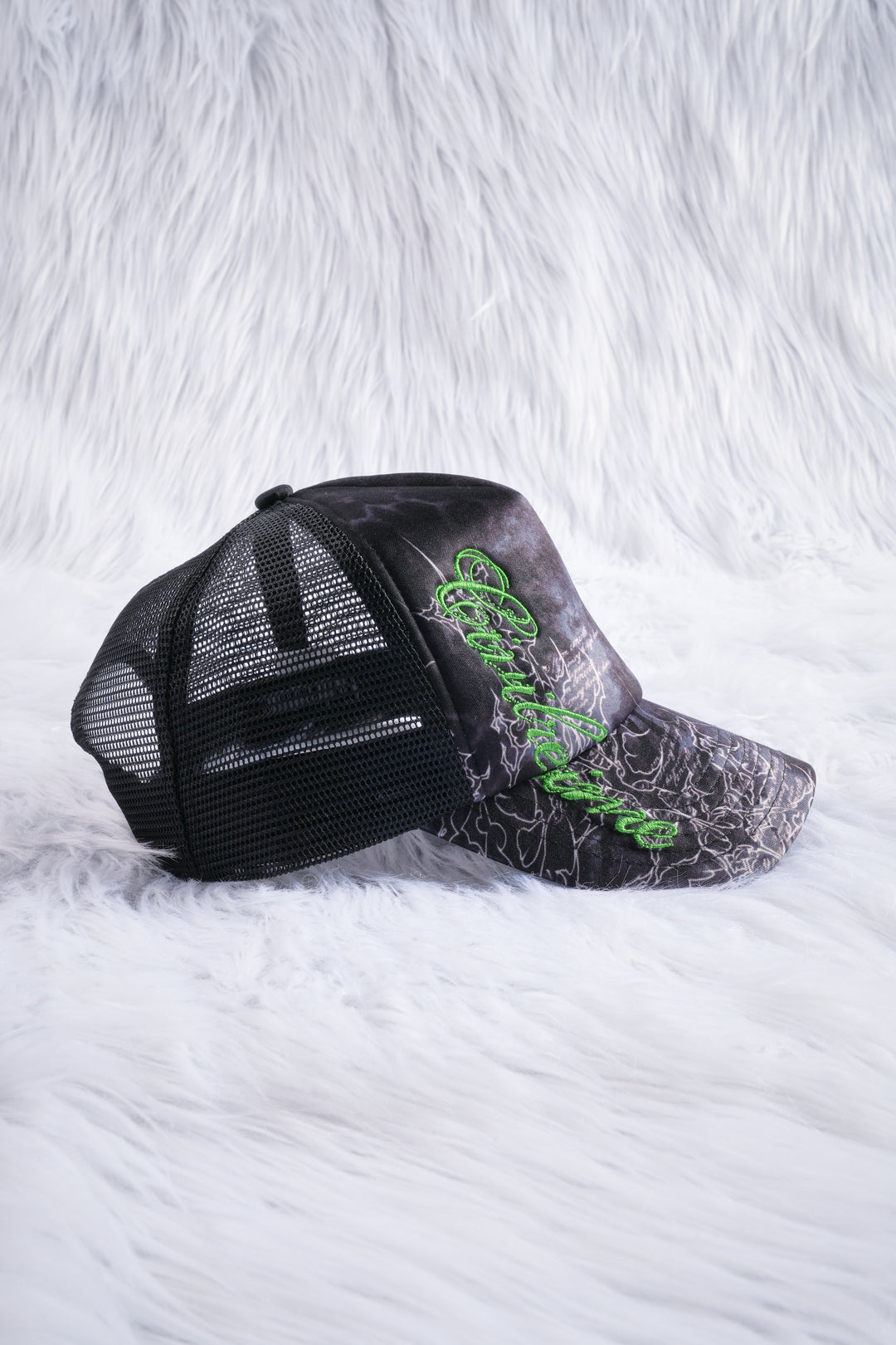 Unpredictable Trucker Hat in Black