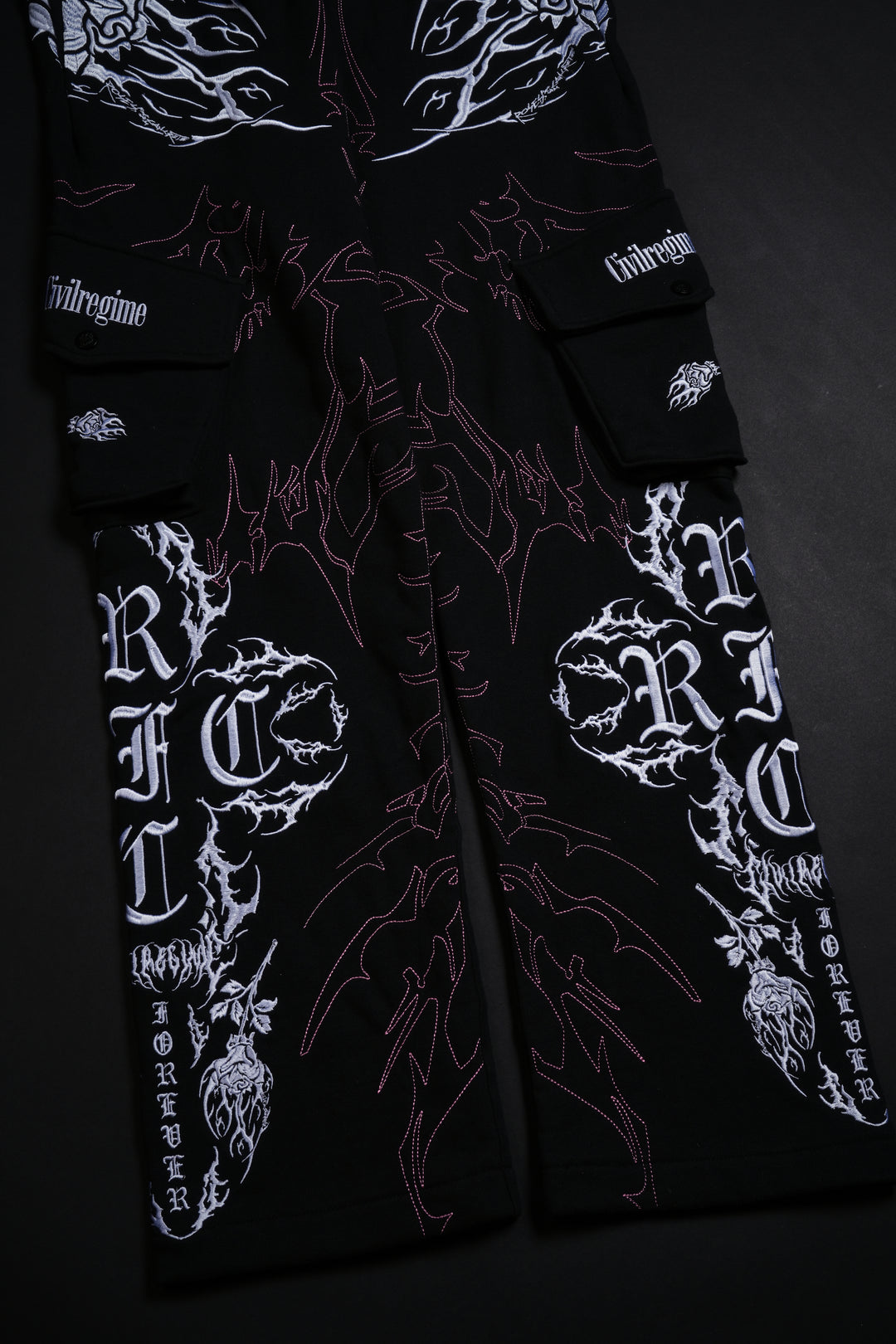 Surging Through The Blossoms Eternal Cargo Pants in Black/Pink